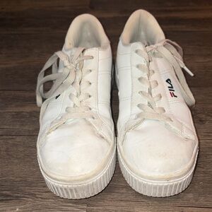 White fila platform sneakers worn